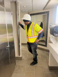 Crew member cleaning an office interior